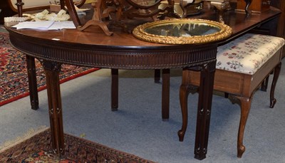 Lot 1419 - A mahogany Chippendale style D-end dining table, the two end sections with drop leaves above a...