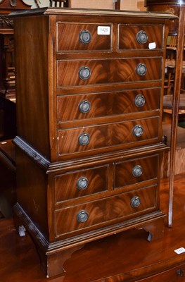 Lot 1425 - A miniature reproduction mahogany chest on chest