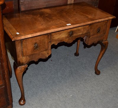 Lot 1438 - A George II walnut low boy