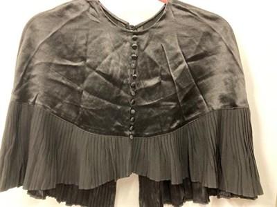 Lot 2011 - Early 20th Century Costume comprising a white rabbit capelet; black silk capelet with pleated...