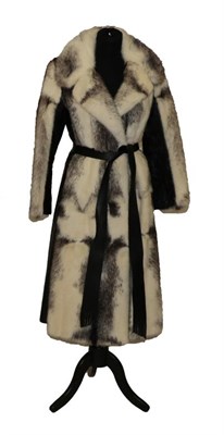 Lot 2083 - Boutique Furs Ltd, London Black and White Mink Knee Length Coat with black leather inserts and belt