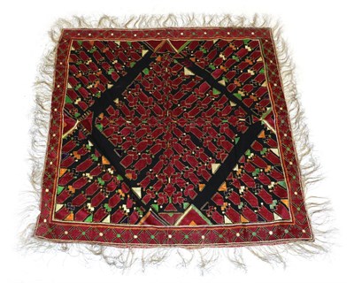 Lot 2093 - An Early 20th Century Indian Panel, woven with a central diamond made up of red embroidered...