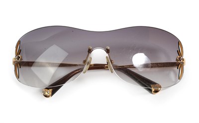 Lot 2111 - Pair of Louis Vuitton Lily Pattern Rimless Sunglasses, with cut out petals to the side of the...