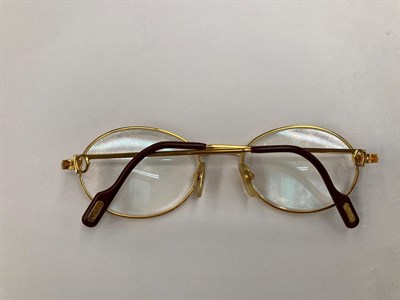 Lot 2119 - Pair of Lady's Cartier Prescription Glasses, with oval gilt metal frames, marked to the reverse...