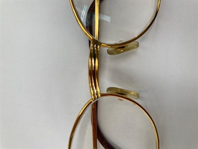 Lot 2119 - Pair of Lady's Cartier Prescription Glasses, with oval gilt metal frames, marked to the reverse...