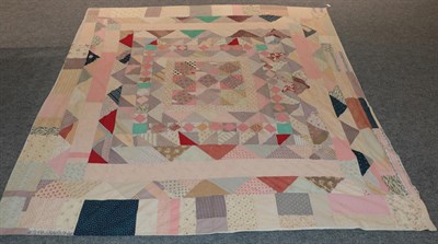 Lot 2159 - Late 19th century/early 20th century patchwork bed cover, incorporating floral sprigged,...