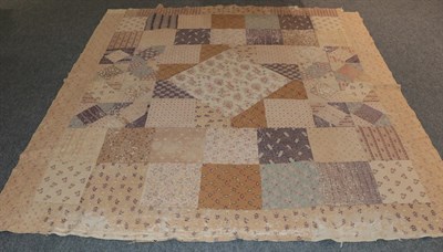 Lot 2162 - A large 19th century patchwork bed cover, incorporating floral sprigged, striped and other coloured