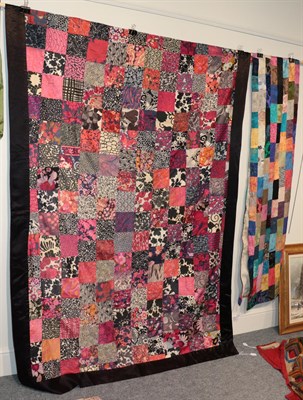 Lot 2168 - Mid 20th century silk sample patchwork worked in colourful rectangles and a cream back, 88cm by...