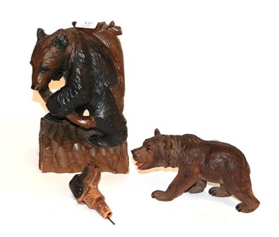 Lot 17 - Two Black Forest type carved bears and a carved decanting dogs head (3)