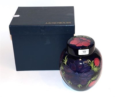 Lot 19 - Moorcroft Anemone ginger jar and cover, on a blue ground, with box