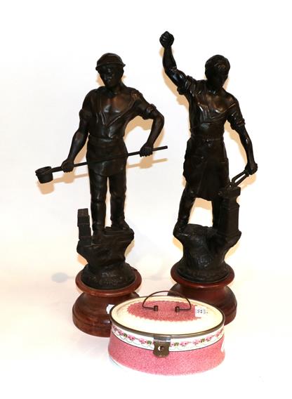 Lot 22 - Pair of spelter figures and a biscuit box