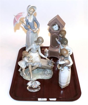 Lot 27 - A selection of five Nao and Lladro figures, with a Swarovski crystal and pearl clam (6)