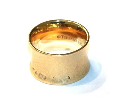 Lot 62 - A band ring, by Tiffany, stamped '750', finger size J