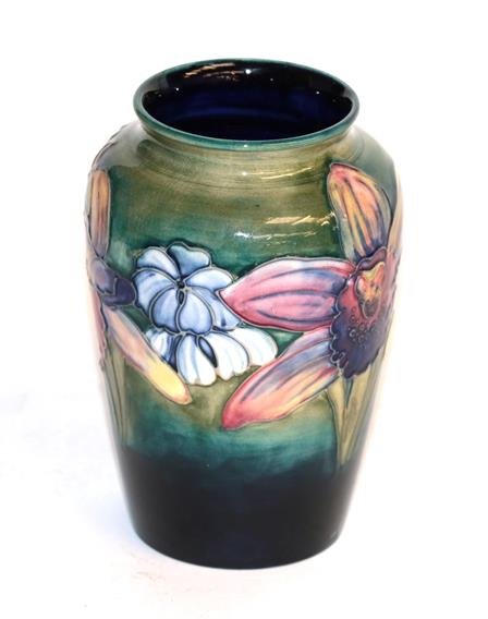 Lot 106 - A Walter Moorcroft Orchid and spring flower vase, impressed factory marks, paper label and...
