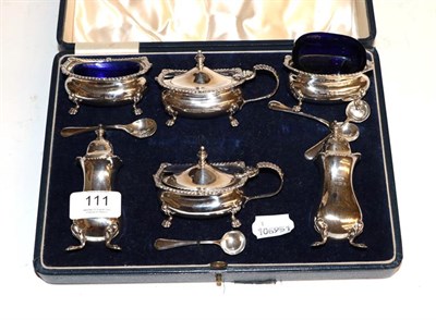 Lot 111 - A George VI silver condiment set, by Mappin and Webb, Birmingham, 1939, each piece bombe and on paw
