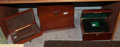 Lot 134 - An Edwardian oak cased stationary box and two fitted jewellery boxes