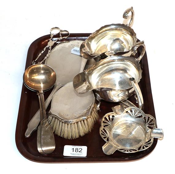 Lot 182 - A selection of silver items including, a dressing table hand mirror and brush, sauce ladles,...