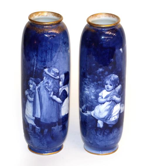 Lot 197 - A near pair of Royal Doulton ''Blue children'' vases, 22.5cm and 22cm high