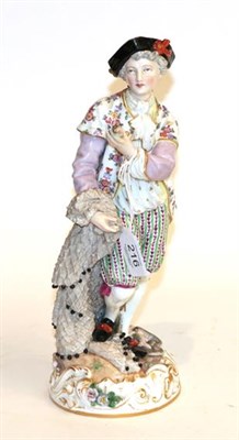 Lot 216 - A 19th century German figure of gentleman holding a fish