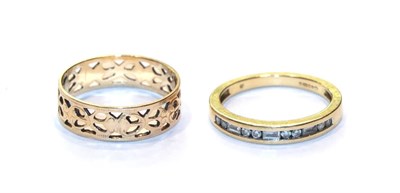 Lot 224 - An openwork band ring, stamped '750', finger size O; and an 18 carat gold half hoop ring,...