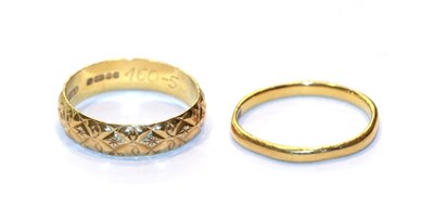 Lot 226 - A 22 carat gold textured band ring, finger size M; and a 22 carat gold band ring, finger size K1/2