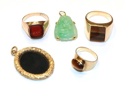 Lot 230 - A 9 carat gold onyx pendant, length 3.7cm; a hardstone signet ring, stamped '585', finger size...