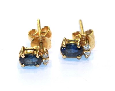 Lot 254 - A pair of sapphire and diamond earrings, stamped '18'