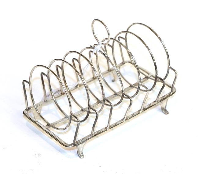 Lot 277 - A George III silver toast-rack, probably by Thomas Wallis, London, 1804, oblong and with seven bars