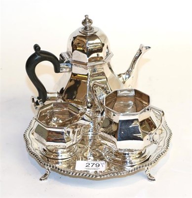 Lot 279 - A three-piece Edward VII silver tea-service, by Henry Matthews, Birmingham, 1906, each piece...