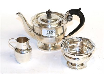 Lot 285 - A Victorian silver teapot, by Nathan and Hayes, Chester, 1897, tapering and on spreading foot, with