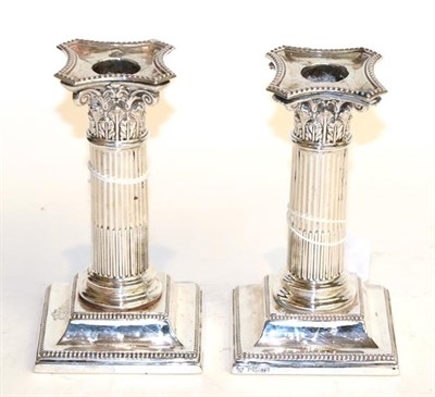 Lot 286 - A pair of Edward VII silver candlesticks, by Hawksworth, Eyre and Co. Ltd., Sheffield, 1905,...