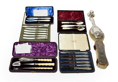 Lot 334 - A cased pair of silver bladed butter knives, Sheffield 1881, with mother of pearl handles; together