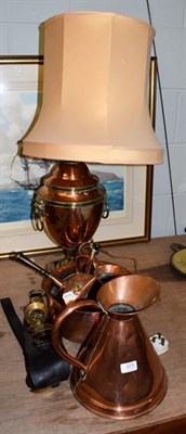 Lot 377 - Two copper measures, a hammered bowl, split kettle, a copper samovar urn converted to a lamp...