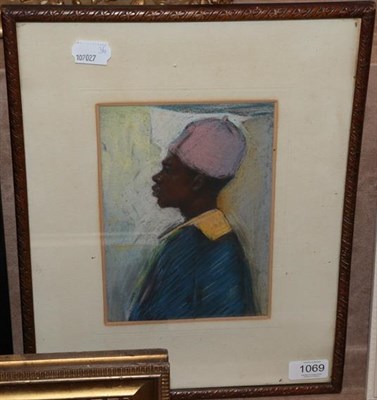 Lot 1069 - Attributed to Lucy Dickens (contemporary) Study of a North African man in hat and coat Pastel, 21cm