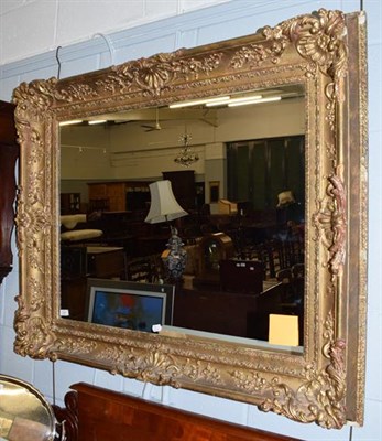 Lot 1232 - A gilt and gesso picture frame mirror, 100cm by 120cm