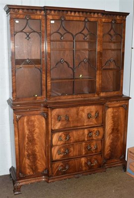 Lot 1238 - A Georgian style mahogany breakfront secretaire bookcase, moulded cornice above astragal glazed...