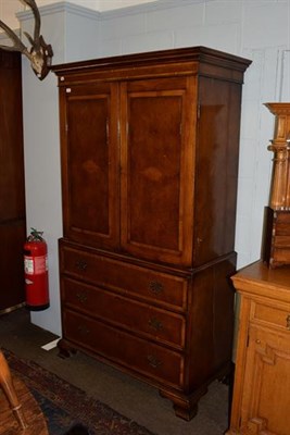 Lot 1240 - A George III oak and burr walnut linen press, moulded cornice above twin handled drawers, two...