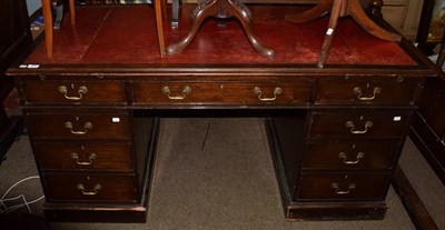 Lot 1251 - A 19th century mahogany twin-pedestal desk, red leather inset above an arrangement of nine...