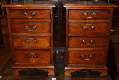 Lot 1276 - A pair of modern mahogany pedestal cabinets of four graduated drawers, 72cm high