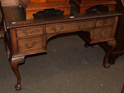 Lot 1277 - A late 19th century mahogany kneehole desk in the Chippendale style, green leather inset, gadrooned