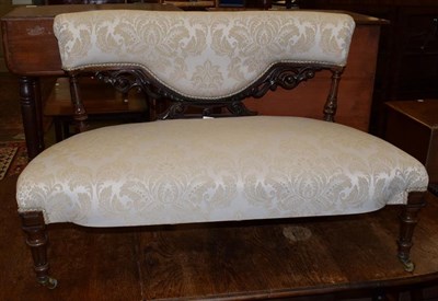 Lot 1278 - A late Victorian twin seat walnut framed salon settee, 112cm wide