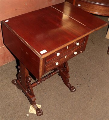 Lot 1285 - A Victorian mahogany work table, twin drop flaps, two frieze drawers, trestle support with...