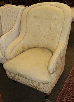 Lot 1303 - A yellow floral upholstered Victorian tub chair