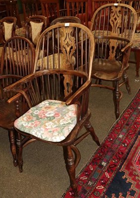 Lot 1309 - A pair of elm seated spindle back Windsor chairs, pierced splats, crinoline stretchers (2)