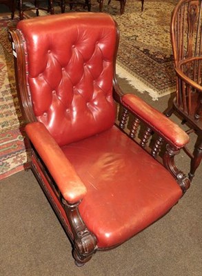 Lot 1314 - A Victorian red leather button upholstered armchair