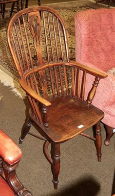 Lot 1315 - A 19th century elm seated stick back Windsor chair, pierced splat with crinoline stretcher