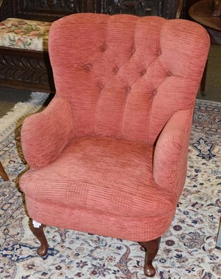 Lot 1316 - A modern button back armchair with fire label