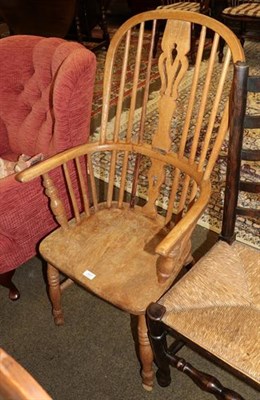 Lot 1317 - An elm seated stick back Windsor chair, pierced splat