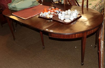 Lot 1318 - A George III mahogany D-end dining table with two additional leaves, square tapered legs, 230cm...