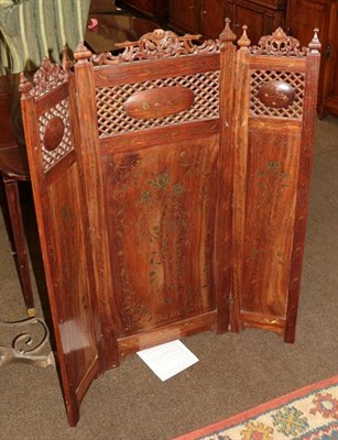 Lot 1326 - An Indian heavily carved folding screen